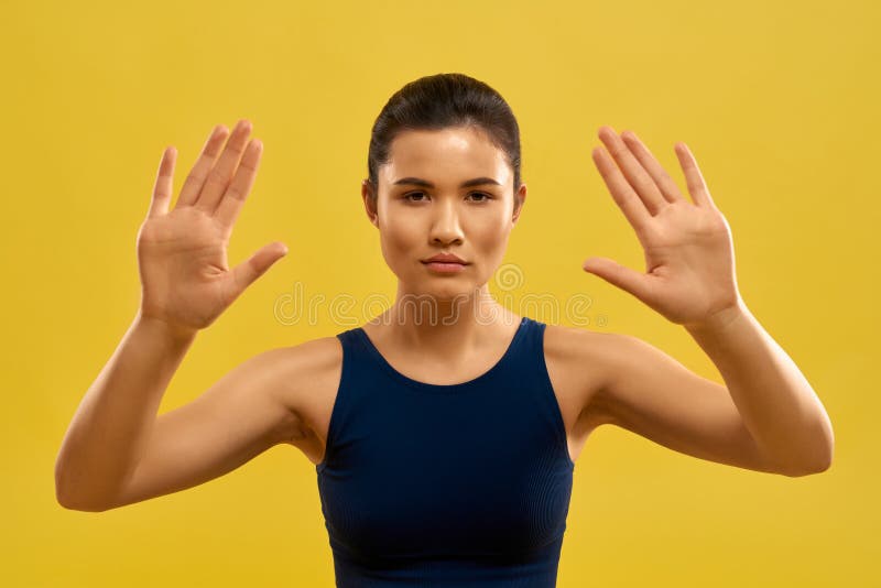 Pretty Girl Raising Hands Holding Palms Looking At Camera Stock Image Image Of Stretching