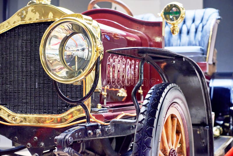 Front view of headlights of red yellow retro car.