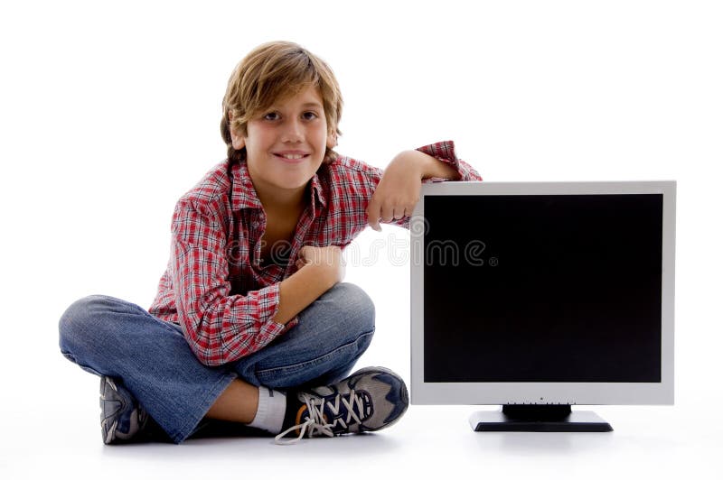 Front view of sitting boy with lcd screen