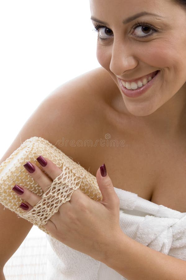 Front view of woman scrubbing her body