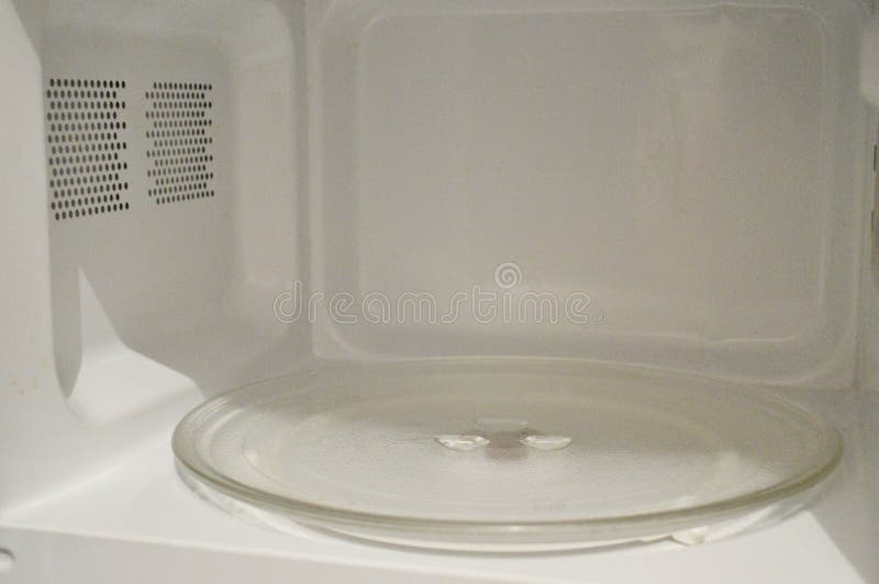 Frontal View Inside White, Empty Clean Microwave Oven Interior Stock