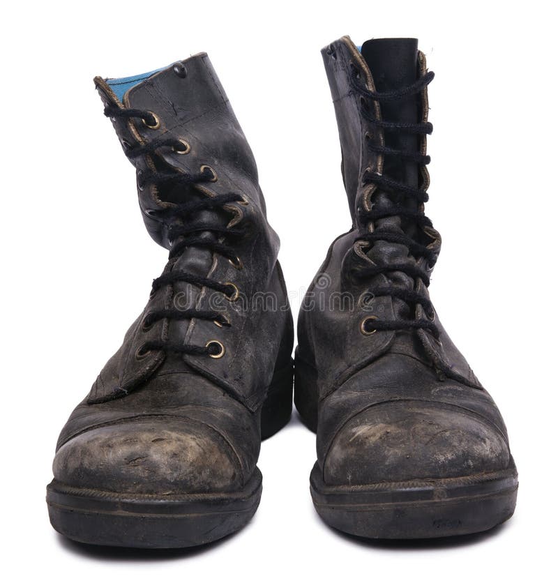 Frontal view of a very worn pair of boots, issued by the Israeli army (IDF). isolated on white background. Frontal view of a very worn pair of boots, issued by the Israeli army (IDF). isolated on white background.