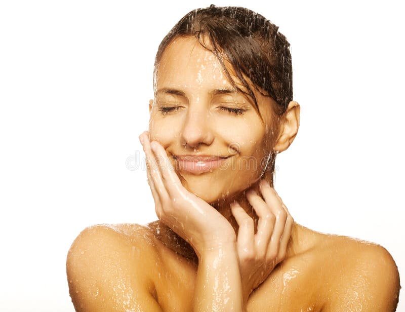 Close-up of beautiful wet woman face with water drop. On white background. Close-up of beautiful wet woman face with water drop. On white background