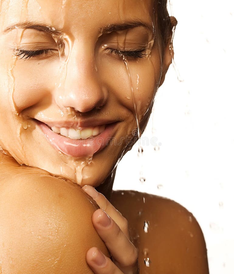 Close-up of beautiful wet woman face with water drop. On white backgroundrr. Close-up of beautiful wet woman face with water drop. On white backgroundrr