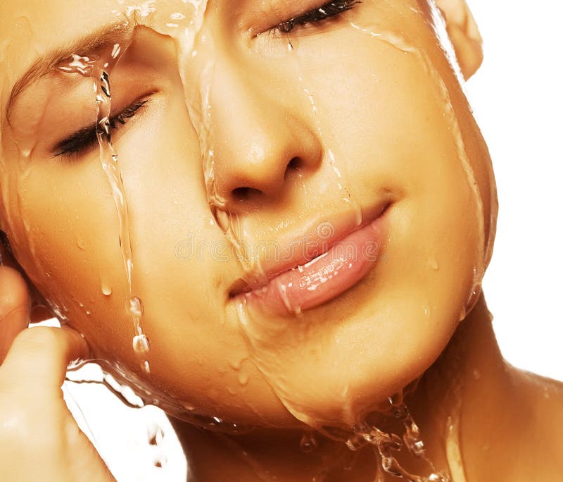 Close-up of beautiful wet woman face with water drop. On white backgroundrr. Close-up of beautiful wet woman face with water drop. On white backgroundrr