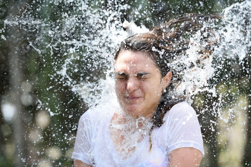 Close up of water spalsh hit woman face. Close up of water spalsh hit woman face