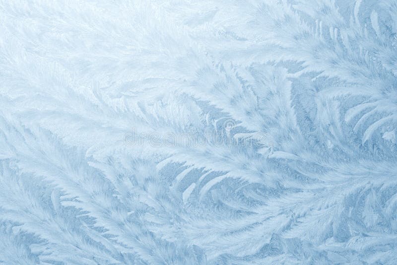 Frost patterns on window glass in winter season. Frosted Glass Texture. Blue background royalty free stock photo Frost patterns on window glass in winter season. Frosted Glass Texture. Blue background royalty free stock photo