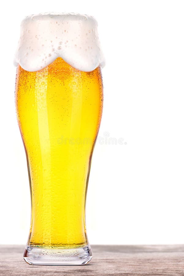 Frosty glass of light beer on a wooden table royalty free stock images Frosty glass of light beer on a wooden table royalty free stock images