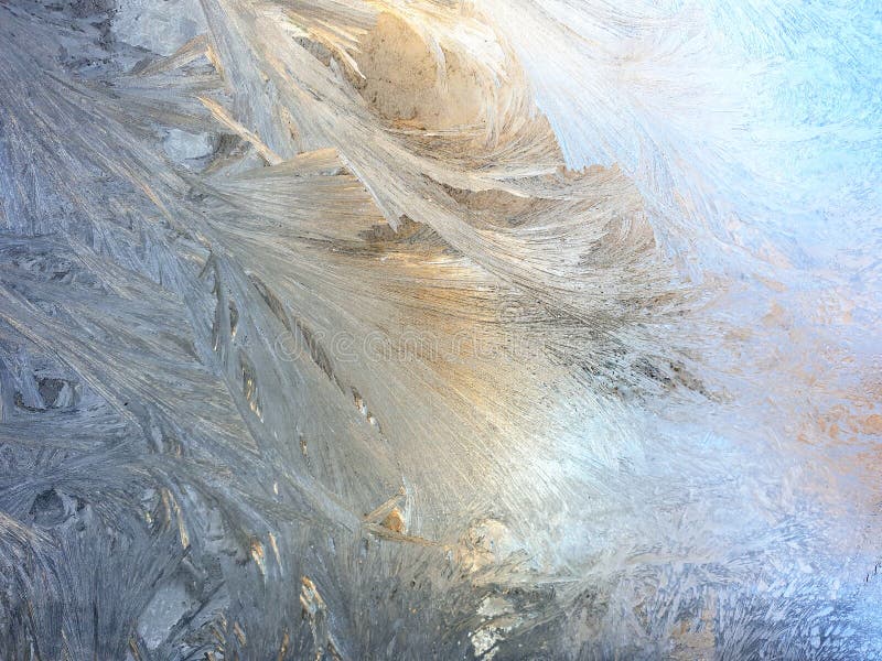 frosty patterns on the window glass closeup. natural textures and backgrounds. ice patterns on frozen