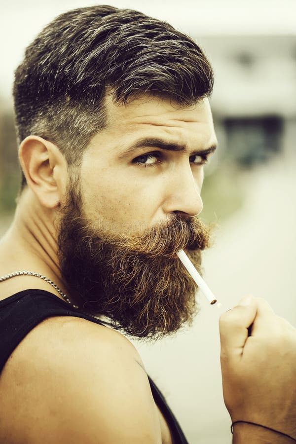 Frown Bearded Man Smoking Cigarette Stock Photo - Image of frown, adult ...