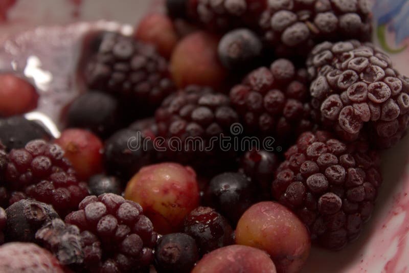 Frozen Berries on a Plate. Summer Fresh Berries. Selective Focus Stock
