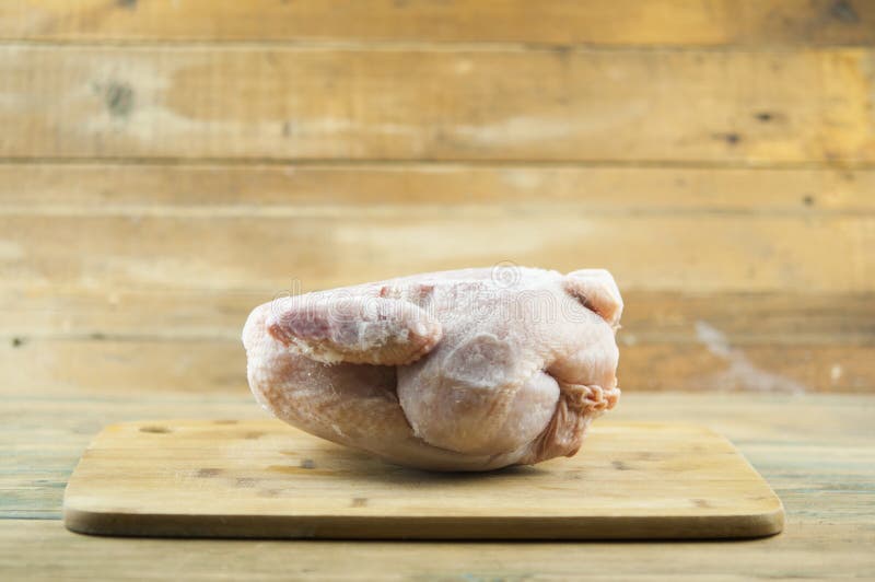 Frozen Chicken Carcass on Wooden Chopping Board Stock Photo Image of