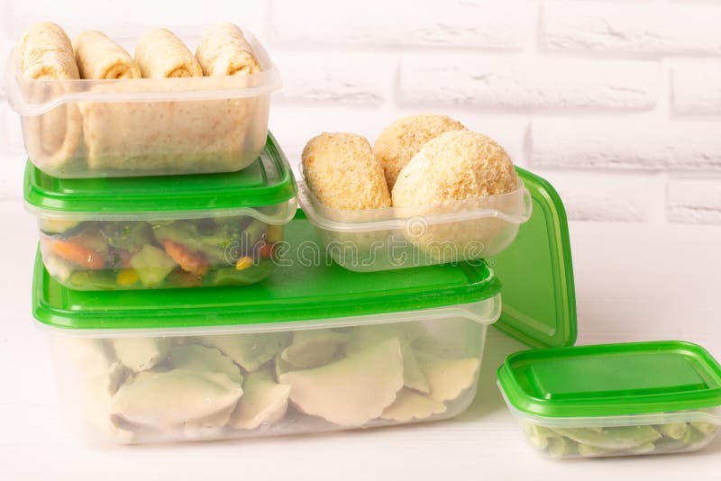 Frozen Convenience Foods and Vegetables in Plastic Containers on a