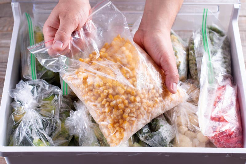 Frozen Corn. Frozen Vegetables in a Plastic Bag in Refrigerator Stock