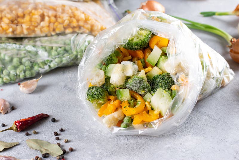 Frozen Mixed Vegetables in a Bag on a Light Concrete Background. Frozen