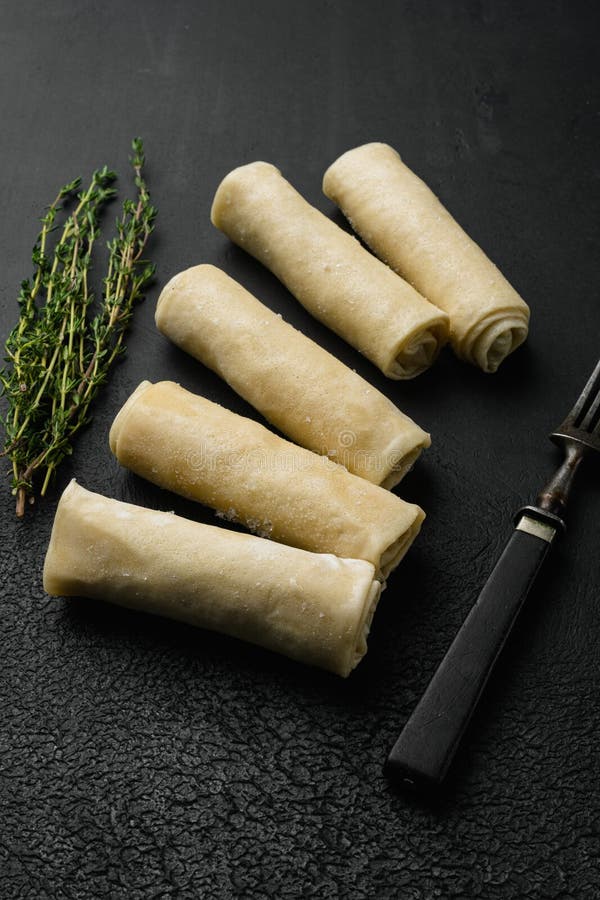 Frozen Pancake Stuffed on Black Dark Stone Table Background Stock Photo