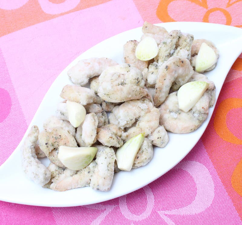 Frozen prawns with garlic stock image. Image of dish 35405139