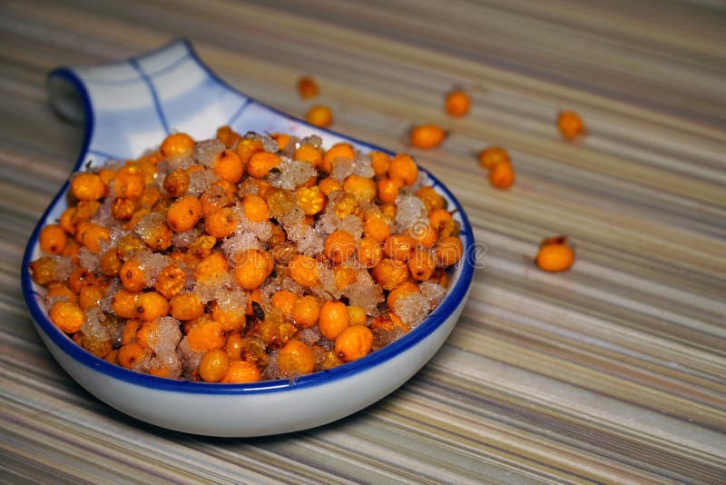 Frozen Sea Buckthorn in a Large Spoon Stock Image - Image of closeup