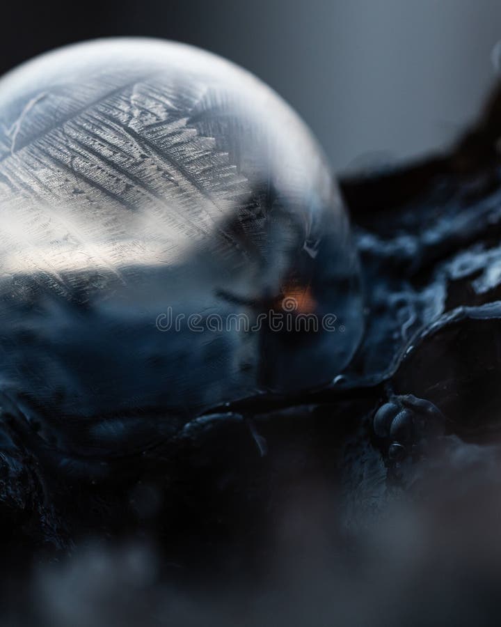 Frozen soap bubble with beautiful light and color on a wooden structure for backgrounds. Soap snowflake stock images, royalty-free photos and pictures