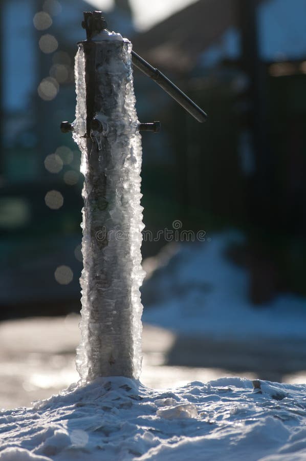 Frozen water-tap on ice rock