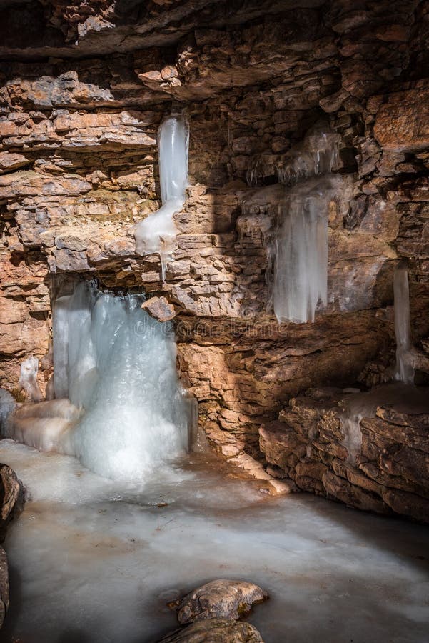 Frozen waterfall in mountain gorge