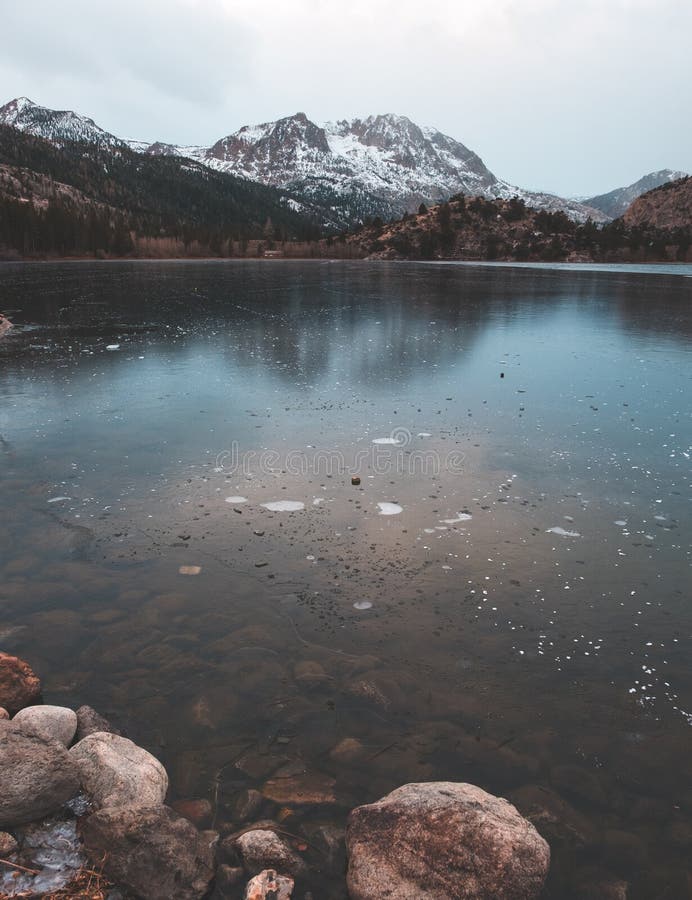 A frozen winter lake with ice bubbles