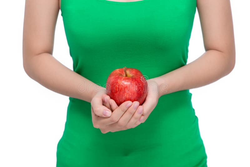 Fruit. Beautiful female hand holding and showing a red apple on stock images Fruit. Beautiful female hand holding and showing a red apple on stock images