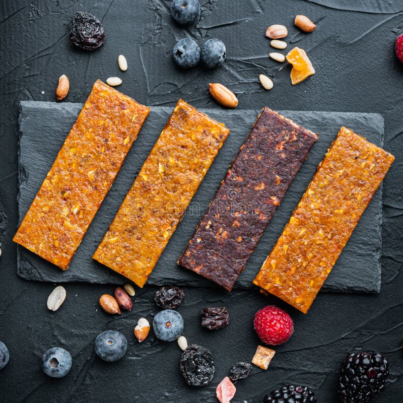 Fruit Berry and Nut Energy Bars, Healthy Snack, Top View,on Black