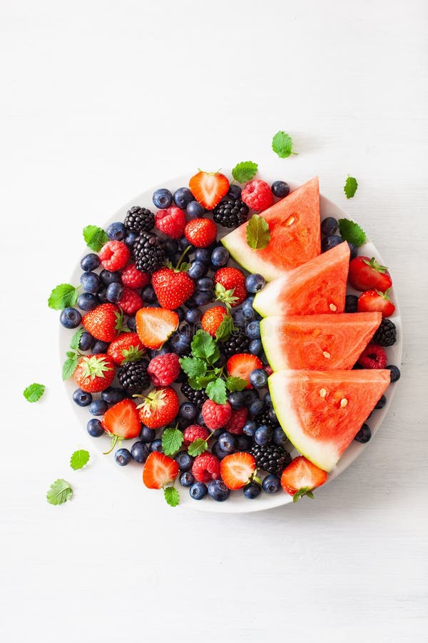 Fruit and berry platter over white. blueberry, strawberry, raspberry, blackberry, watermelon