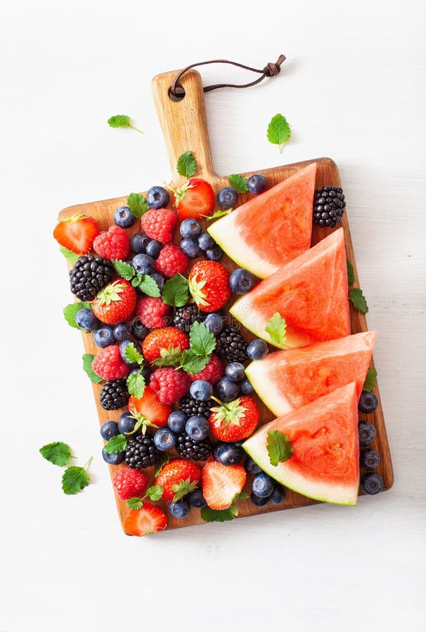 Fruit and berry platter over white. blueberry, strawberry, raspberry, blackberry, watermelon