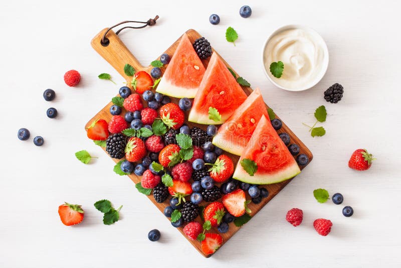 Fruit and berry platter over white. blueberry, strawberry, raspberry, blackberry, watermelon