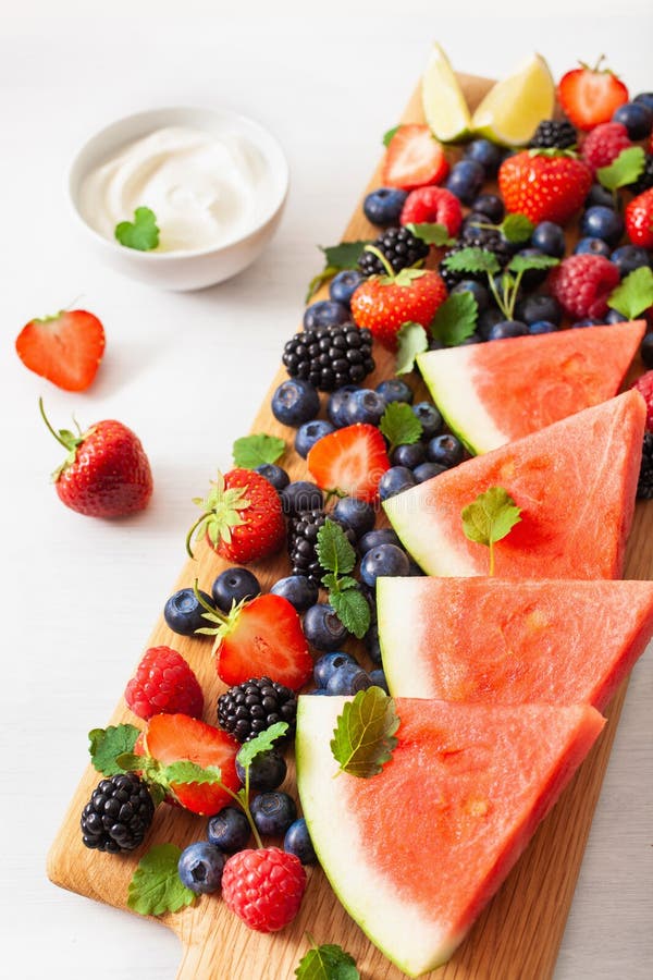 Fruit and berry platter over white. blueberry, strawberry, raspberry, blackberry, watermelon