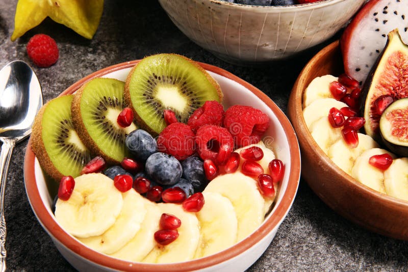 Fruit Bowl. Bowl of Healthy Fresh Fruit Salad on Rustic Background