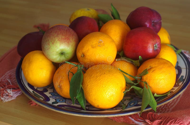 Fruit bowls filled with various types of fruit, tangerine oranges apples. Fruit bowls filled with various types of fruit, tangerine oranges apples