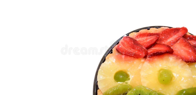 Fruit cake with oranges, kiwi, grapes, pineapple and strawberries closeup isolated on white background with place for text. stock photos Fruit cake with oranges, kiwi, grapes, pineapple and strawberries closeup isolated on white background with place for text. stock photos