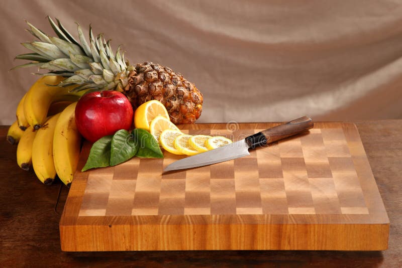 Fruit on a chopping board stock photo. Image of cutting 55765388