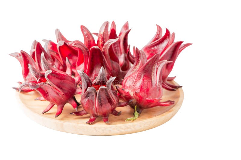 Fruit de Roselle d'isolement du plat en bois image stock Fruit de Roselle d'isolement du plat en bois image stock