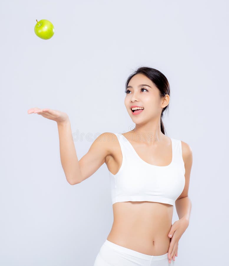 Fruit et beautif de sourire de pomme de vert de jet de femme asiatique de portrait photo libre de droits Fruit et beautif de sourire de pomme de vert de jet de femme asiatique de portrait photo libre de droits