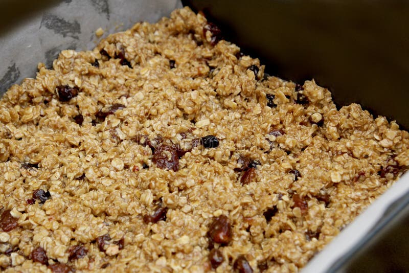 Fruit Flapjack Mix Ready To Bake in the Oven, Black Background with Copy Space for Text Stock