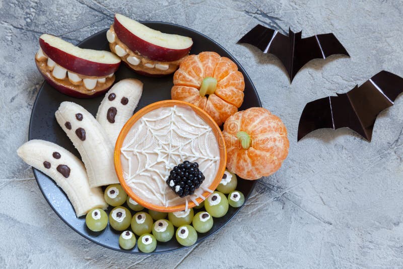 Fruit Halloween Treats. Banana Ghosts and Clementine Orange Pumpkins, Apple Monster Mounts and Spider Web