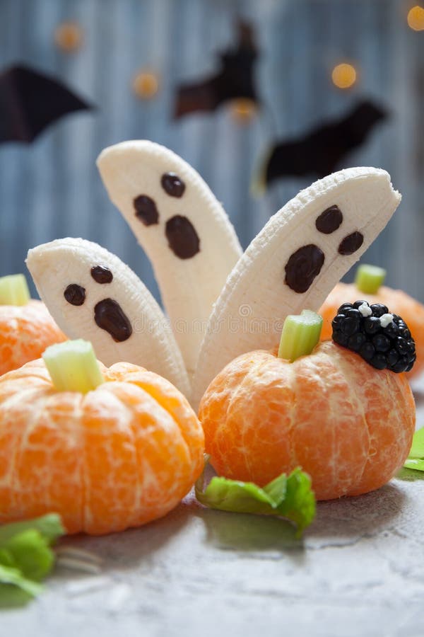 Fruit Halloween Treats. Banana Ghosts and Clementine Orange Pumpkins
