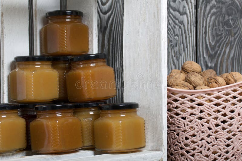 Fruit Jam in Jars. Stands in a Wooden Box Painted White Stock Photo