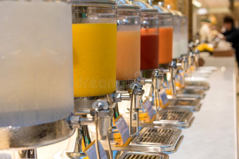 Fruit Juice in Water Cooler for Breakfast at the Hotel Stock Photo