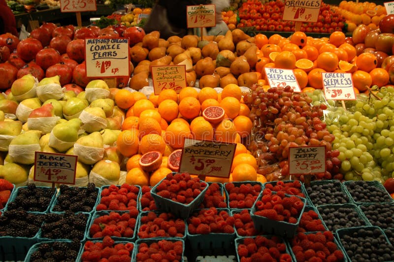 Fruit market with oranges, apples, pears, berries and grapes