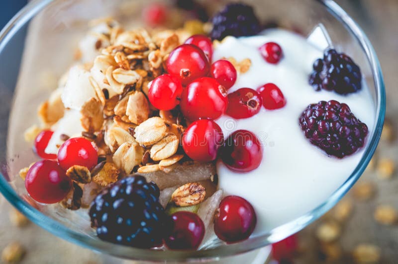 Fruit, Oat and Nut Granola with Yogurt and Raspberries. Stock Image