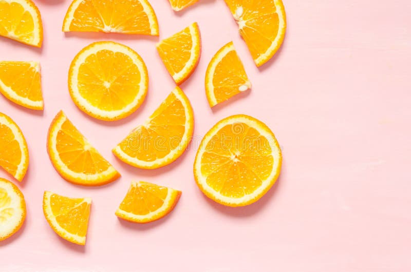 Fruit pattern of fresh orange slices on pastel background. Top view. Copy space. stock images Fruit pattern of fresh orange slices on pastel background. Top view. Copy space. stock images