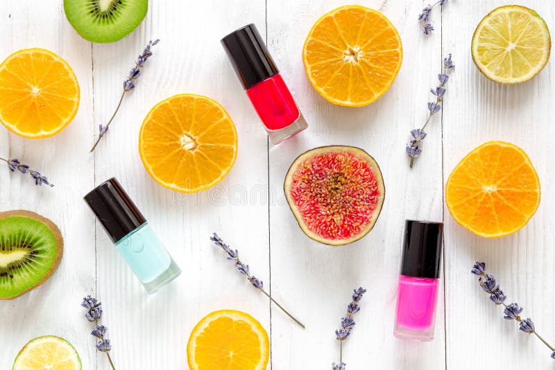 Fruit pattern with lipstick and nailpolish on white desk background top view royalty free stock photos Fruit pattern with lipstick and nailpolish on white desk background top view royalty free stock photos