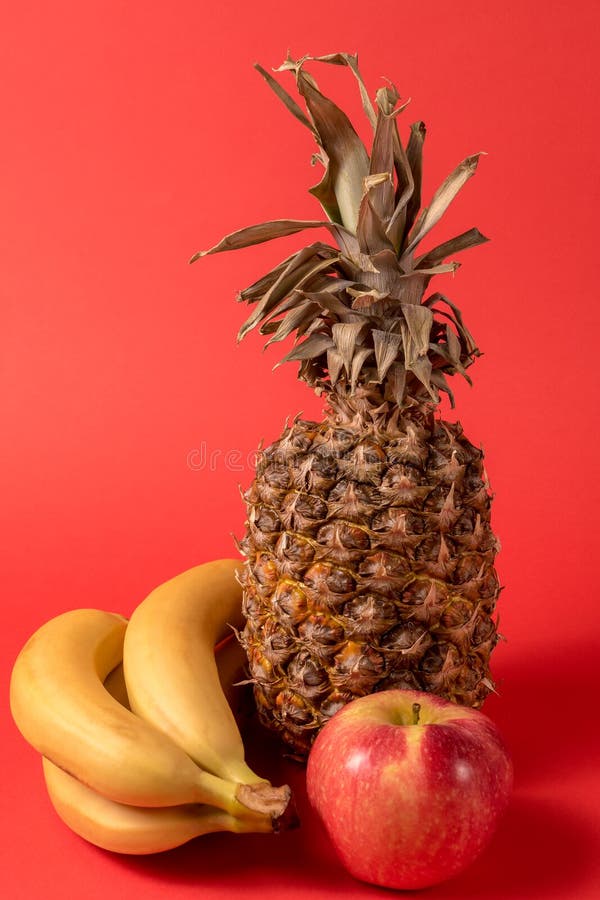 Fruit Pineapple Fruit Apple And Banana Over Red Bright Background