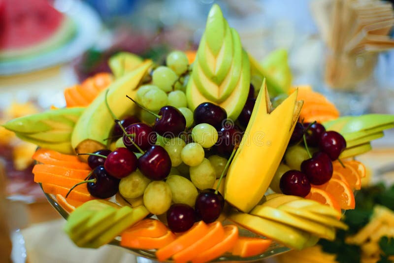 Fruit Plate with Fresh Grapes, Cherries, Orange, Banana and Apple Stock