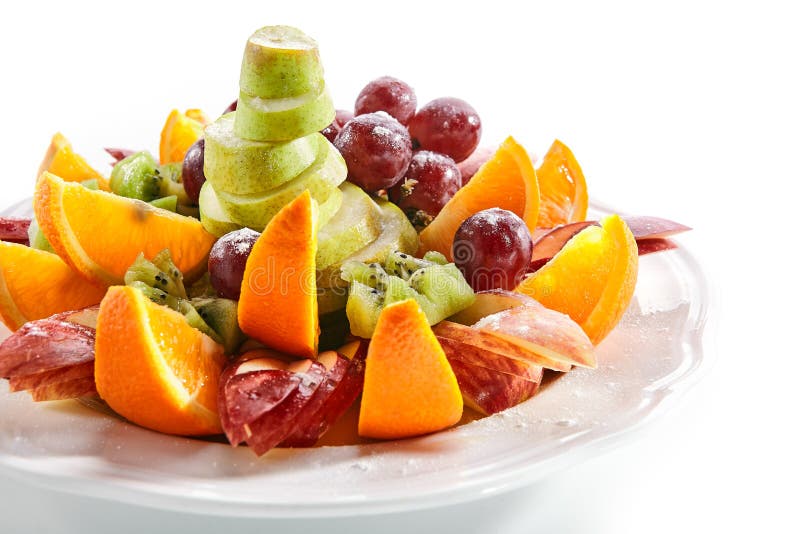 Fruit Plate With Orange Wedges, Apple, Grapes, Kiwi And Pear Stock